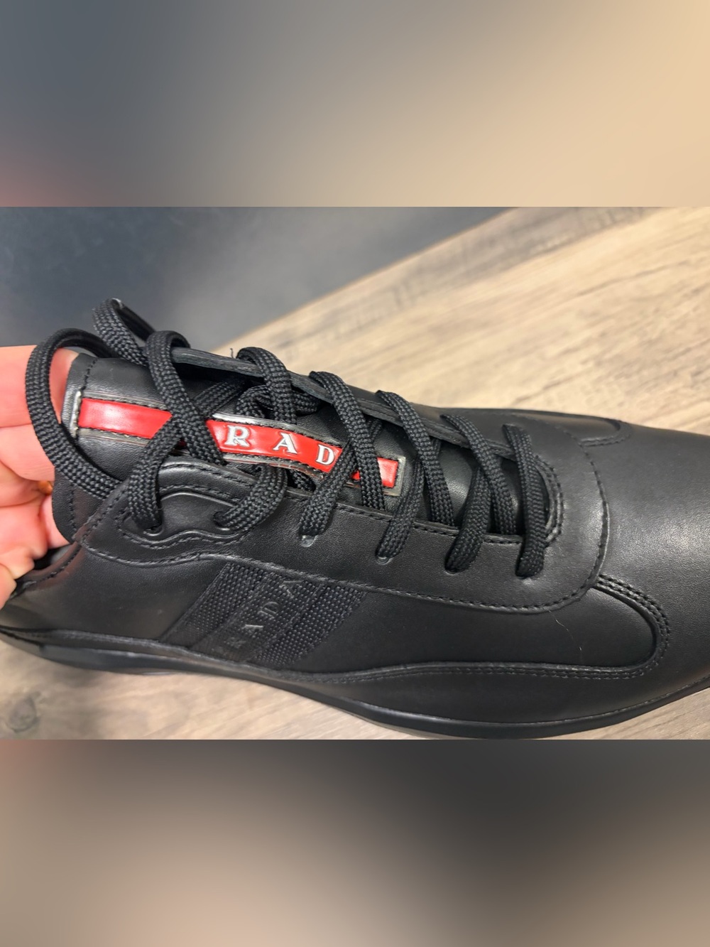 Prada Black Leather Sneaker with Red Logo Tab